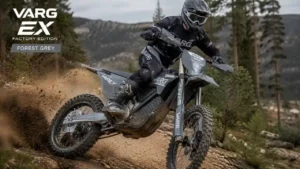 Stark Varg EX Factory Edition electric enduro motorcycle riding on a dirt trail in Forest Grey livery